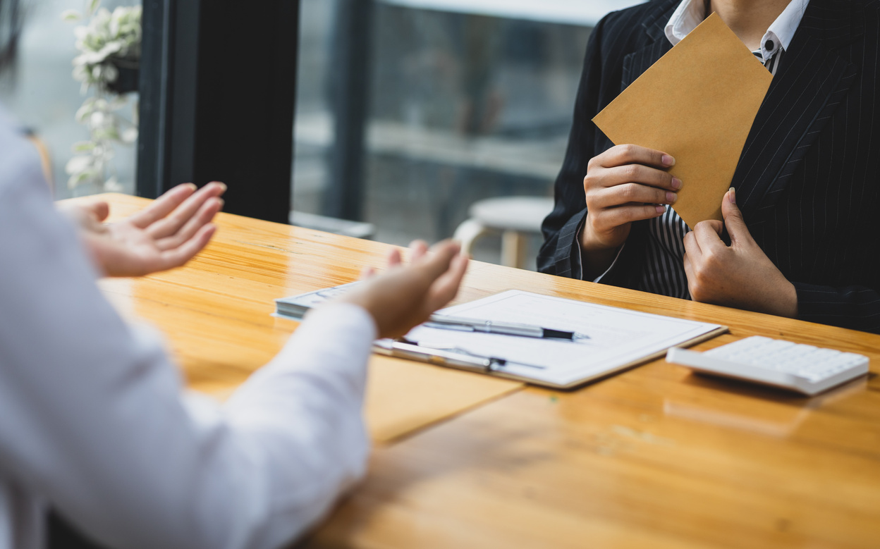 Businesswoman get paid wages or salaries. Bribery signing concept.